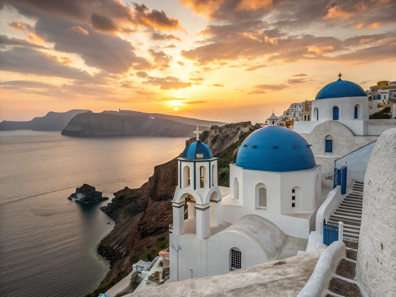 Whitewashed houses and traditional windmills in Oia Santorini